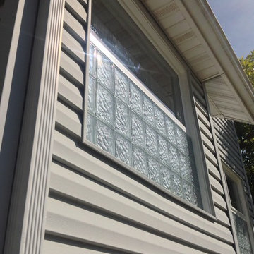 Glass block security window with vinyl sliding glass window