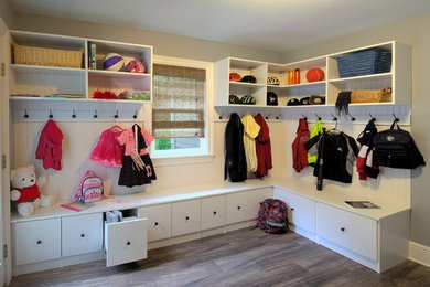 Mudroom - mid-sized traditional dark wood floor and gray floor mudroom idea in Orange County with gray walls