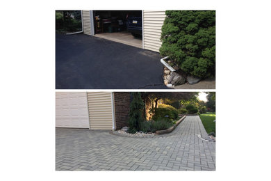 Design ideas for a mid-sized partial sun front yard stone driveway in Philadelphia.