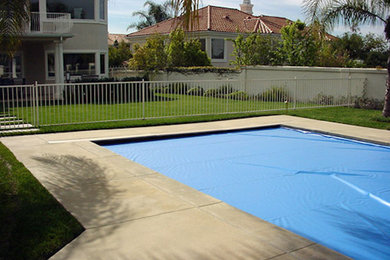 Large rectangular pool in Miami with concrete slab.