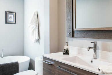 Inspiration for a small contemporary freestanding bathtub remodel in Toronto with flat-panel cabinets and brown cabinets