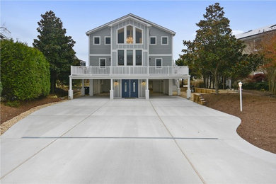 Example of a beach style home design design in Other