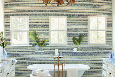 Photo of a traditional bathroom in New Orleans with a freestanding tub and mosaic tile.