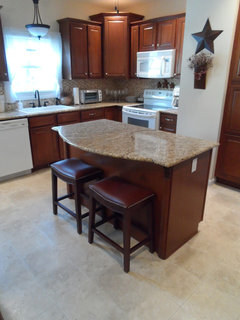 Installing Laminate Flooring under kitchen cabinets? Yes or no?