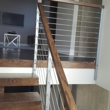 Open riser stairs with stainless steel cable wire railing