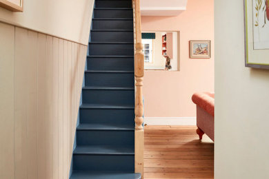 Photo of a contemporary staircase in London with tongue and groove walls.