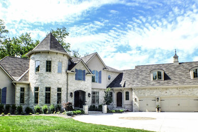 Huge elegant beige two-story stone exterior home photo in Cleveland