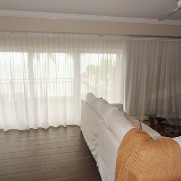 Ripple fold blackout and sheer drapes.