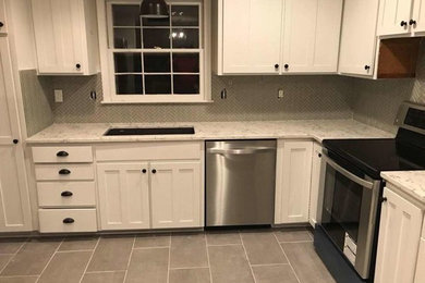 Inspiration for a modern l-shaped enclosed kitchen remodel in Charlotte
