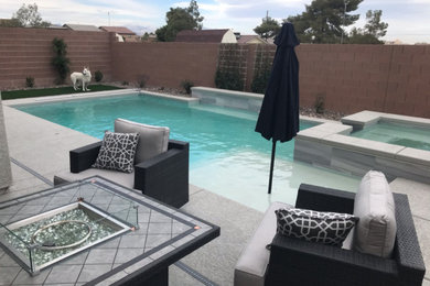 Inspiration for a small modern backyard rectangular pool remodel in Las Vegas with decking