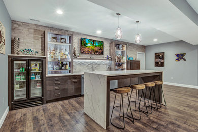 Home bar - mid-sized brown floor home bar idea in St Louis