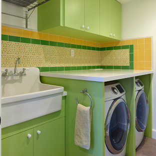 Medium sized contemporary single-wall separated utility room in San Francisco with an utility sink, flat-panel cabinets, green cabinets, engineered stone countertops, white walls, concrete flooring, a side by side washer and dryer, grey floors and white worktops.