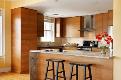 Inspiration for a mid-sized modern l-shaped medium tone wood floor and brown floor eat-in kitchen remodel in Burlington with an undermount sink, flat-panel cabinets, medium tone wood cabinets, granite countertops, gray backsplash, glass sheet backsplash, stainless steel appliances and an island