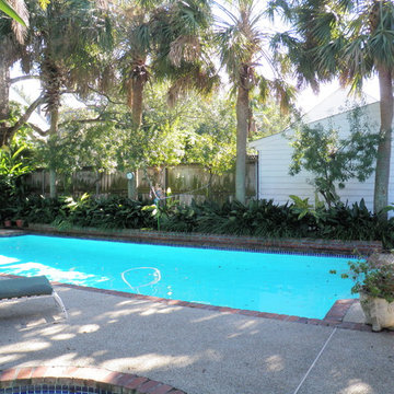 Pool, waterfall, and landscaping