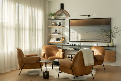 Mid-sized minimalist open concept light wood floor and brown floor living room photo in DC Metro with white walls, no fireplace and no tv