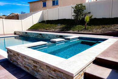 Example of a small minimalist backyard concrete and rectangular hot tub design in Los Angeles