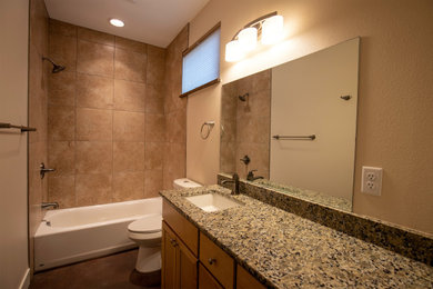 Inspiration for a mid-sized contemporary brown tile concrete floor and single-sink bathroom remodel in Denver with brown cabinets, granite countertops and a built-in vanity