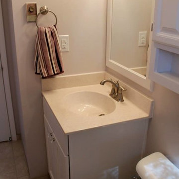 Maple Adams White Vanity, Polystone Shimmer Top, Delta Faucet Linden Fixtures