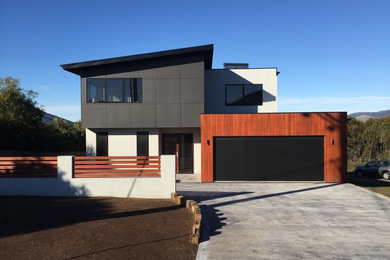 This is an example of a mid-sized beach style garage in Hobart.