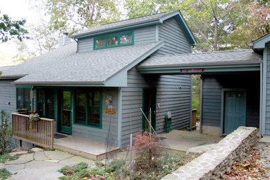 Mid-sized contemporary blue three-story wood gable roof idea in New York
