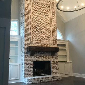 German Schmear on two story brick fireplace