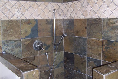 This is an example of a mid-sized traditional 3/4 bathroom in Sacramento with raised-panel cabinets, dark wood cabinets, an alcove shower, gray tile, slate, white walls, slate floors, an undermount sink, granite benchtops, brown floor and an open shower.