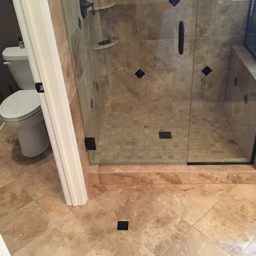 Custom Travertine Bathroom with Black Galaxy Accents