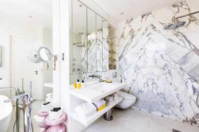 Photo of a mid-sized contemporary master bathroom in Paris with furniture-like cabinets, a drop-in tub, an open shower, a wall-mount toilet, white tile, mosaic tile, beige walls, mosaic tile floors, a wall-mount sink, quartzite benchtops, beige floor, an open shower, white benchtops, a niche, a single vanity and a built-in vanity.