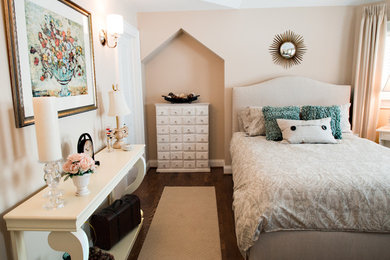 Example of a mid-sized transitional guest medium tone wood floor and brown floor bedroom design in Detroit with beige walls and no fireplace