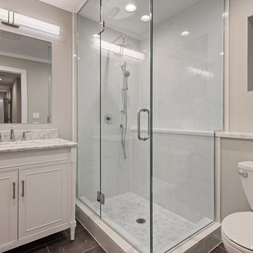 White and Brown Spacious Bathroom with Shower and Large Mirror
