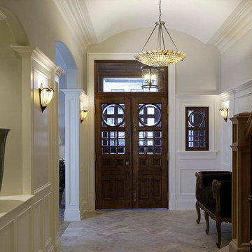 Classic Greystone Foyer with Herringbone Limestone Floors