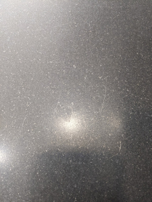 Help please Metal? marks on honed absolute black granite?