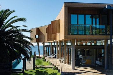This is an example of a large beach style home design in Wollongong.