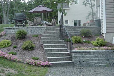 Inspiration for a mid-sized timeless one-story mixed siding exterior home remodel in New York