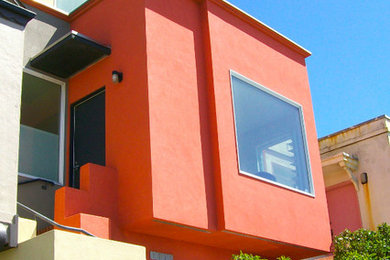 Photo of a mid-sized contemporary three-storey stucco multi-coloured exterior in San Francisco with a flat roof.