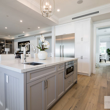 Acama Traditional Cape Cod Kitchen onlooking to family room