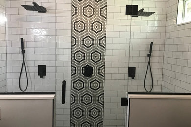 Double shower - large transitional master white tile and ceramic tile vinyl floor and brown floor double shower idea in Baltimore with shaker cabinets, gray cabinets, a one-piece toilet, gray walls, an undermount sink, quartz countertops, a hinged shower door and white countertops