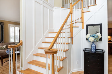 Medium sized staircase in Other with panelled walls.