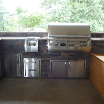L Shaped Outdoor Kitchen With Unique Lighting