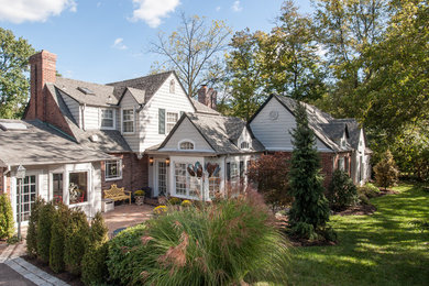 Inspiration for a mid-sized timeless beige one-story concrete fiberboard exterior home remodel in St Louis