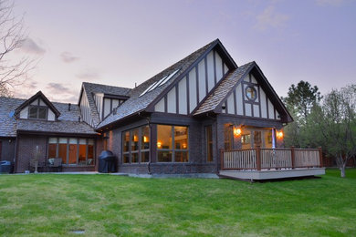 Mid-sized elegant gray one-story brick gable roof photo in Other
