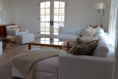 Living room - mid-sized coastal formal and open concept light wood floor and beige floor living room idea in New York with white walls, no tv, a standard fireplace and a wood fireplace surround