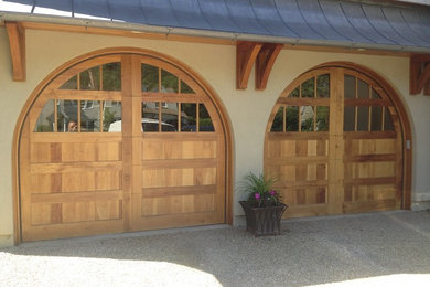 Inspiration for a large transitional attached two-car garage remodel in New York
