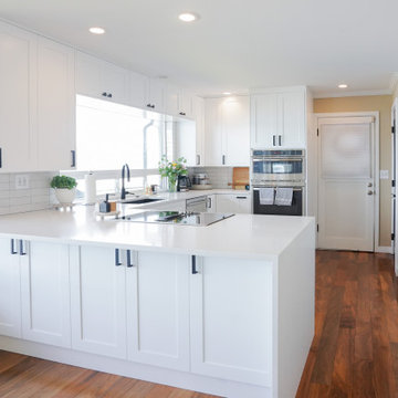 White Kitchen with Wooden Flooring