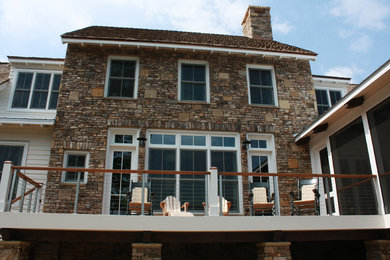 Country two-story wood exterior home photo in Other