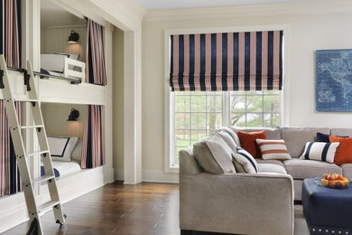 Mid-sized transitional boy medium tone wood floor and brown floor kids' room photo in St Louis with white walls
