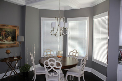 Example of a mid-sized transitional dark wood floor kitchen/dining room combo design in Indianapolis with gray walls and no fireplace