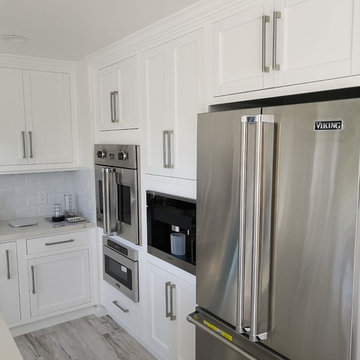 built in coffee machine , microwave , oven