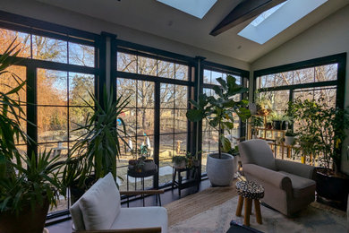 Example of a mid-sized urban porcelain tile, black floor and exposed beam home office design in Chicago with white walls