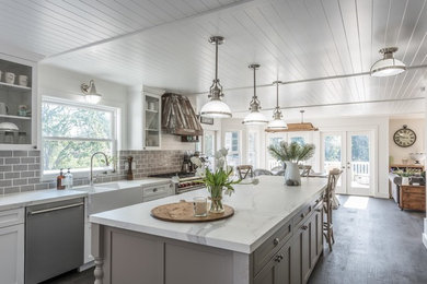 Eat-in kitchen - large transitional l-shaped medium tone wood floor eat-in kitchen idea in San Francisco with a farmhouse sink, shaker cabinets, white cabinets, tile countertops, gray backsplash, ceramic backsplash, stainless steel appliances and an island